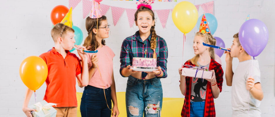 A joyful birthday party scene with children, balloons, and cake, highlighting the fun of an affordable celebration.