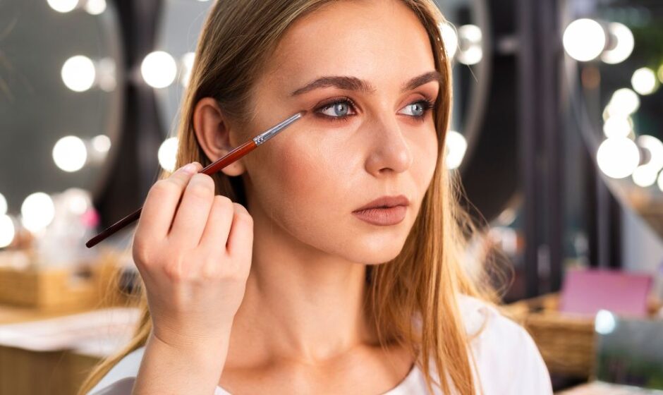 Women Apply Eyeshadow